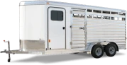 Livestock trailer with slatted sides and tandem axles.